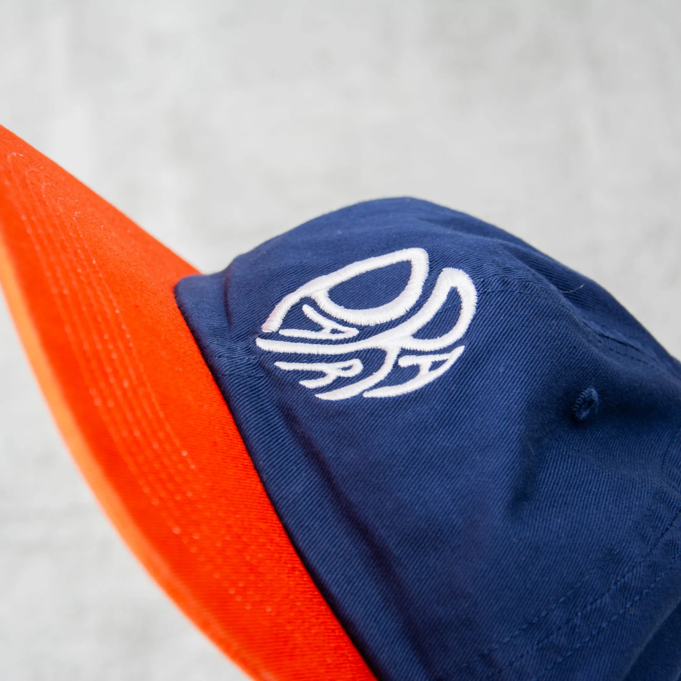 By Parra Circle Tweak Logo 6 Panel Cap - Navy / Orange